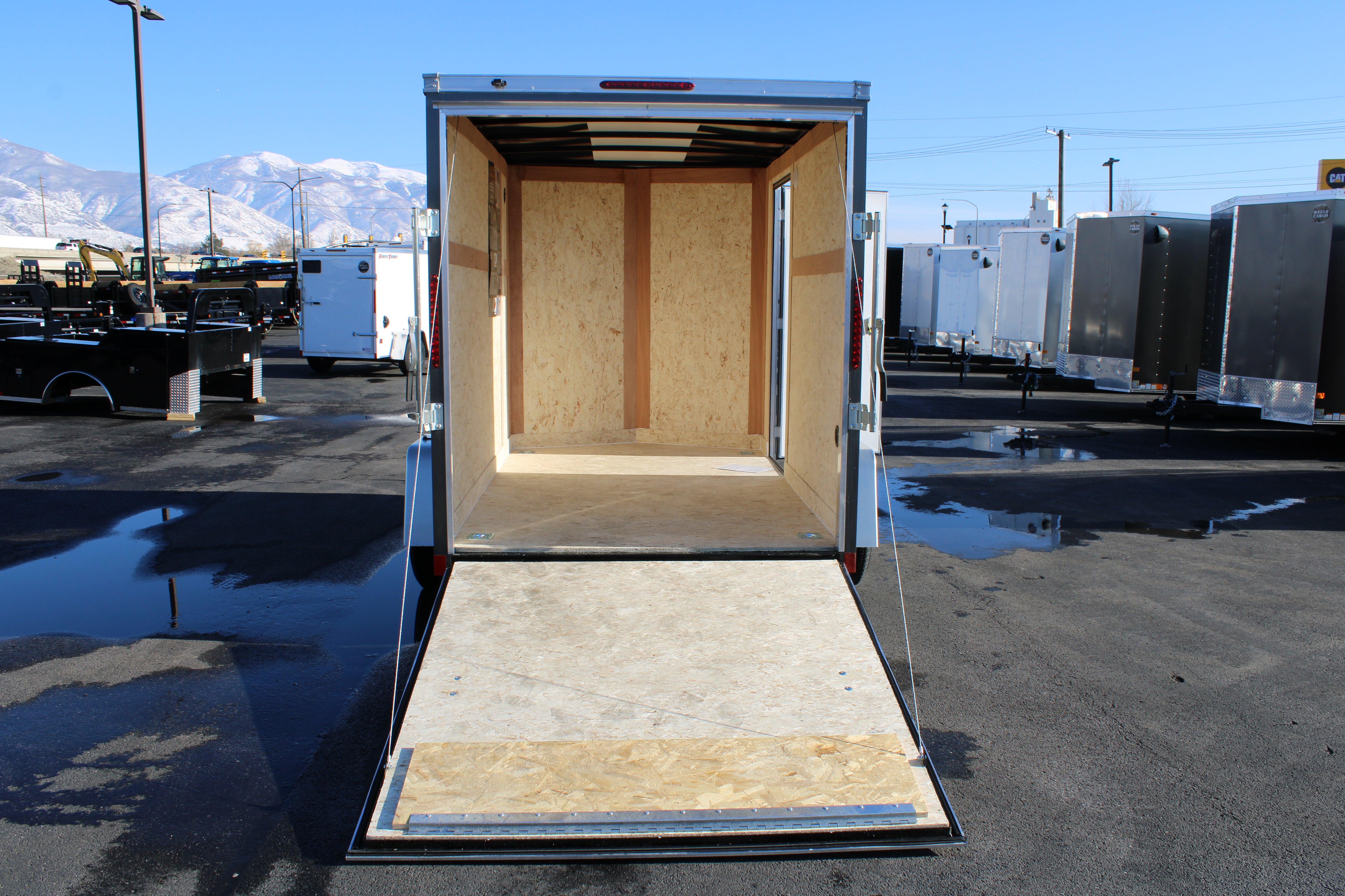 2025 Wells Cargo 6 x 10 Deluxe Enclosed Trailer